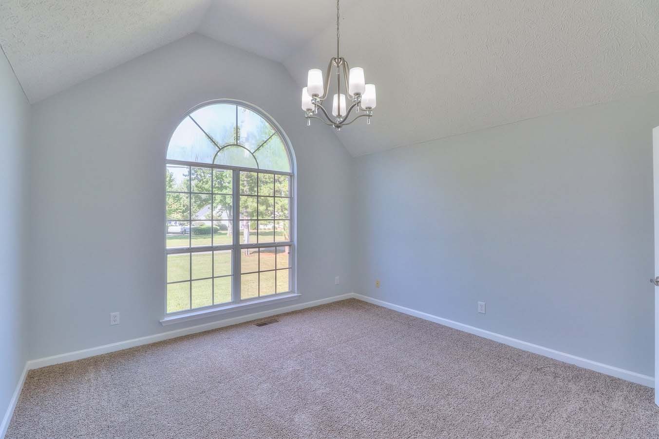 2891 Sulphur Springs Road Murfreesboro, TN 37129 - Photo 19 of 31 an empty room with windows and chandelier