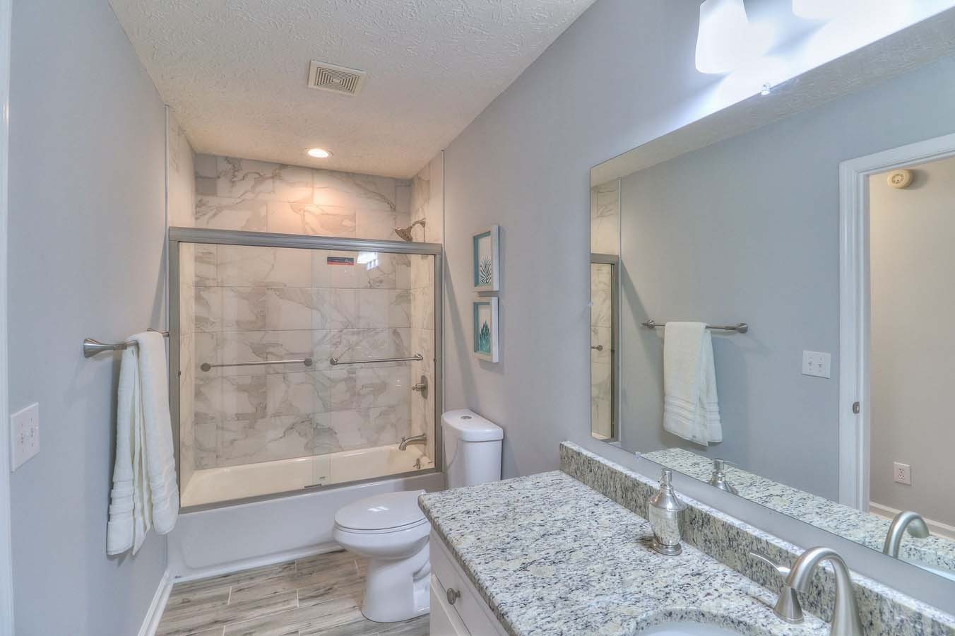 2891 Sulphur Springs Road Murfreesboro, TN 37129 - Photo 20 of 31 a bathroom with a granite countertop sink a toilet and shower