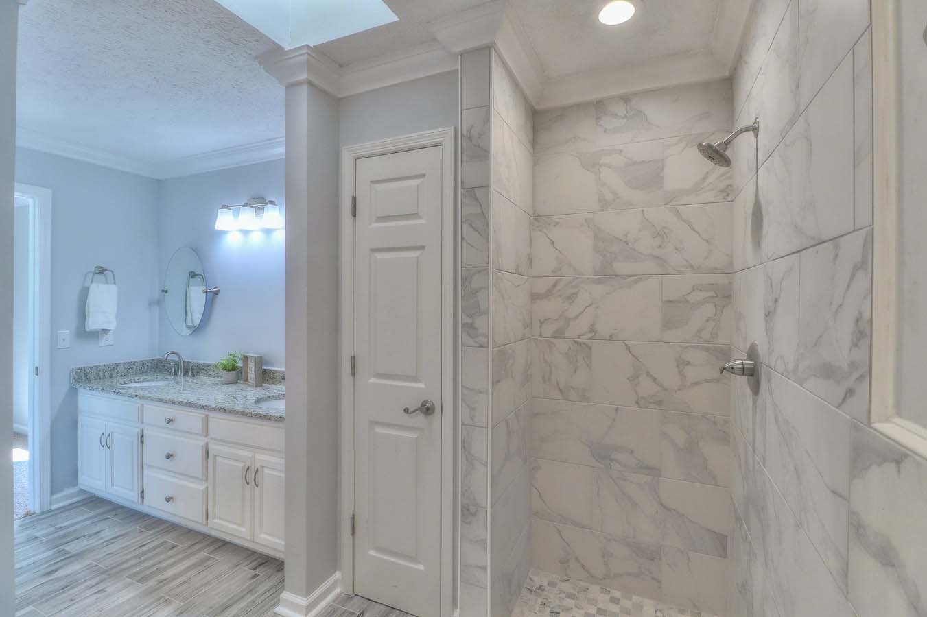2891 Sulphur Springs Road Murfreesboro, TN 37129 - Photo 25 of 31 a bathroom with a granite countertop sink a mirror and a shower