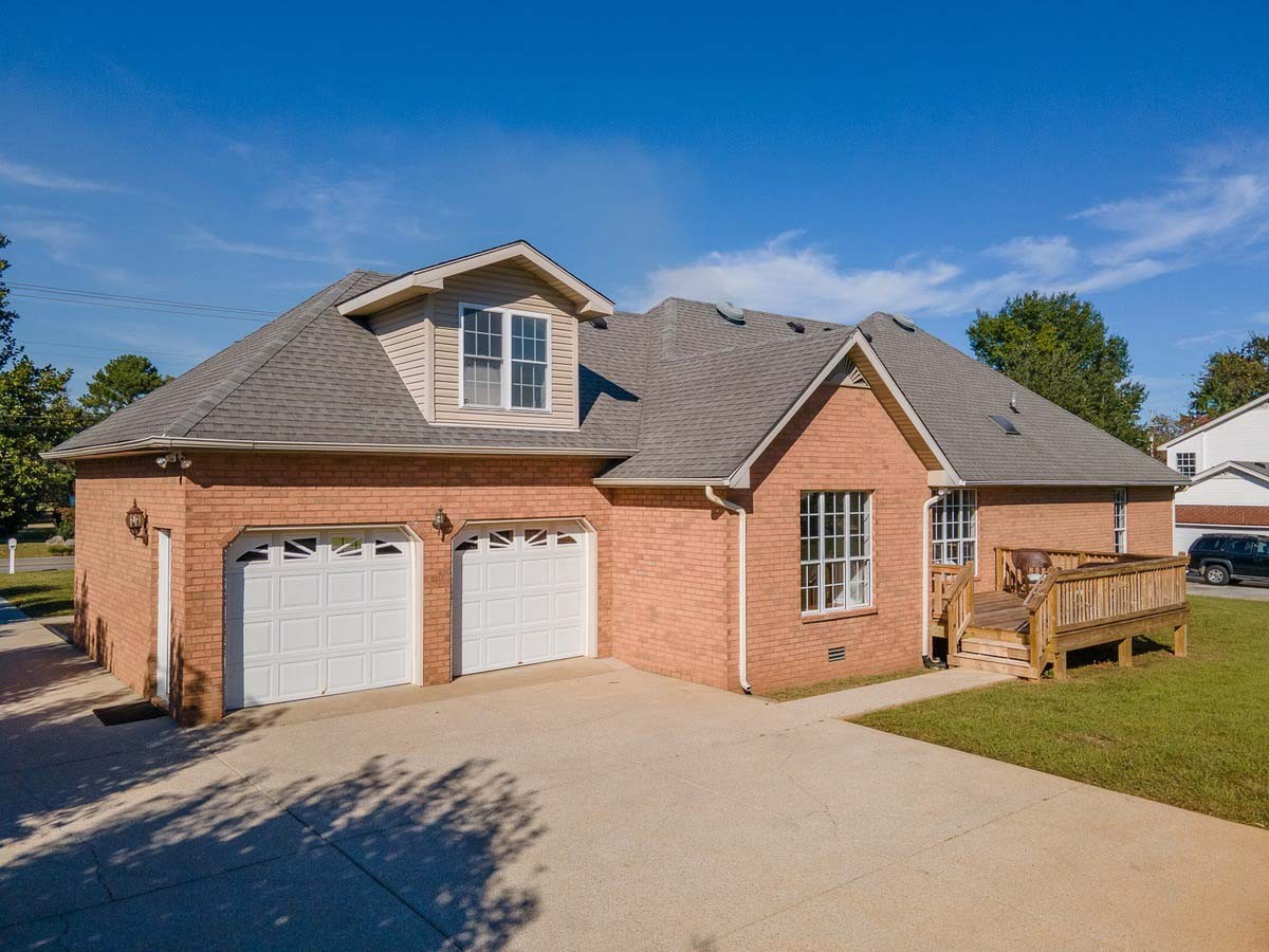 2891 Sulphur Springs Road Murfreesboro, TN 37129 - Photo 4 of 31 a front view of a house with a yard and garage