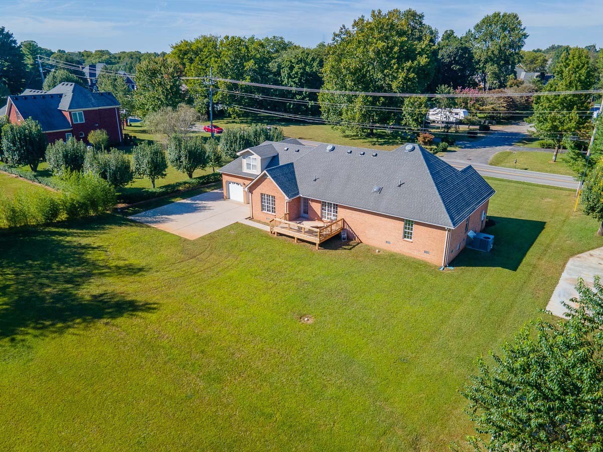2891 Sulphur Springs Road Murfreesboro, TN 37129 - Photo 6 of 31 an aerial view of a house with swimming pool a yard and lake view