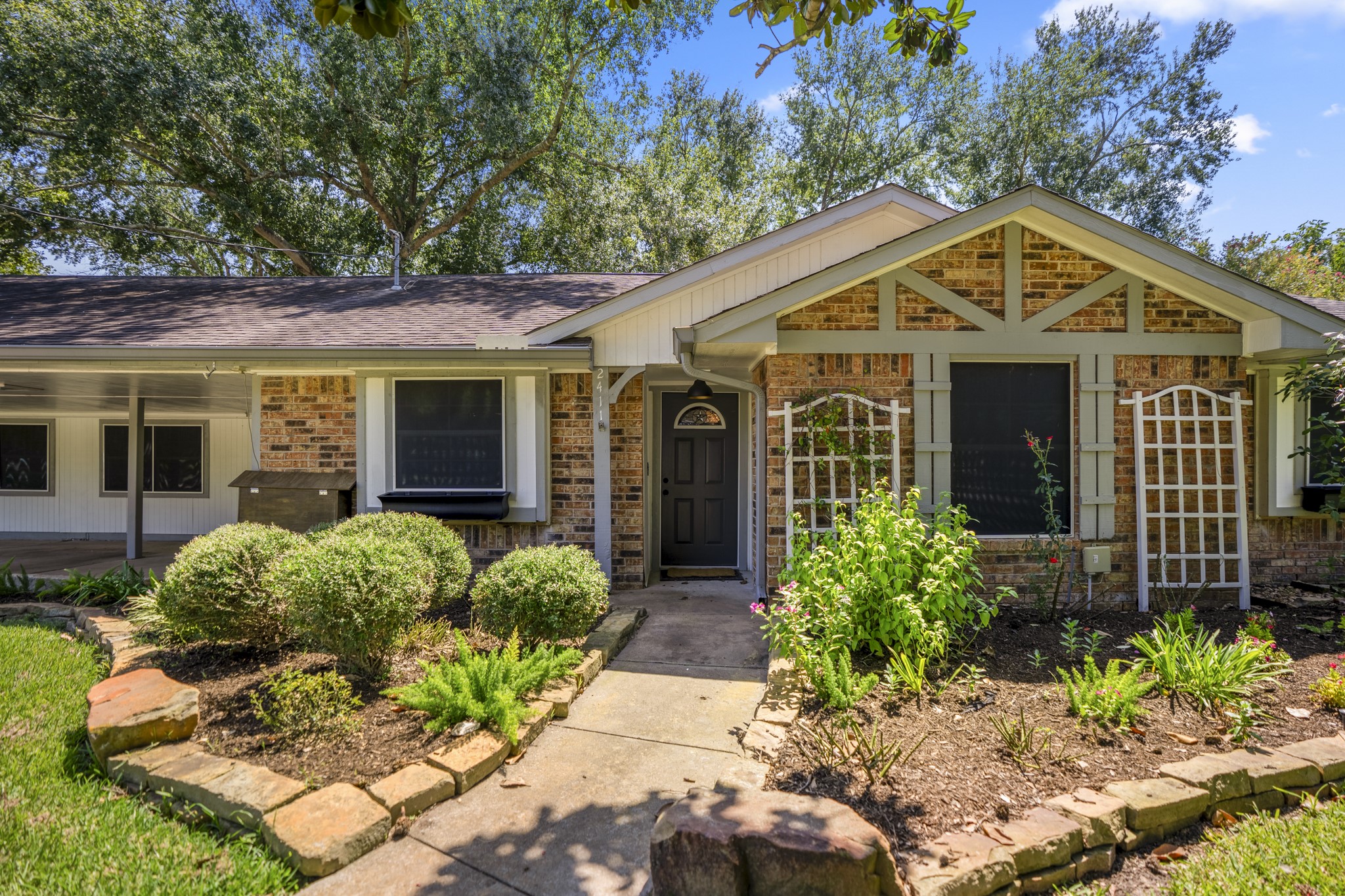 a front view of a house with garden