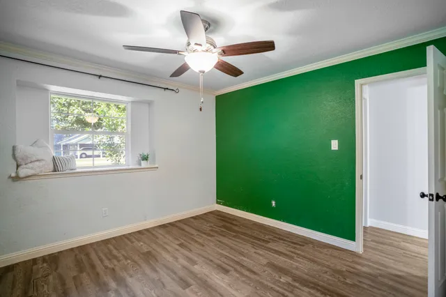 a view of room with window and hardwood