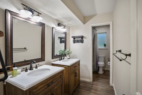 a spacious bathroom with a sink and a mirror