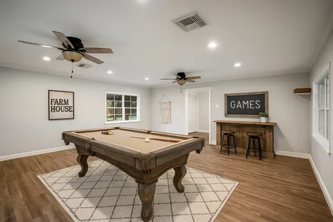 a view of a room with furniture wooden floor and window