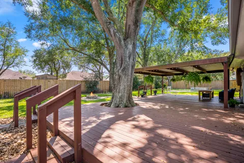 a view of yard with wooden floor and roof