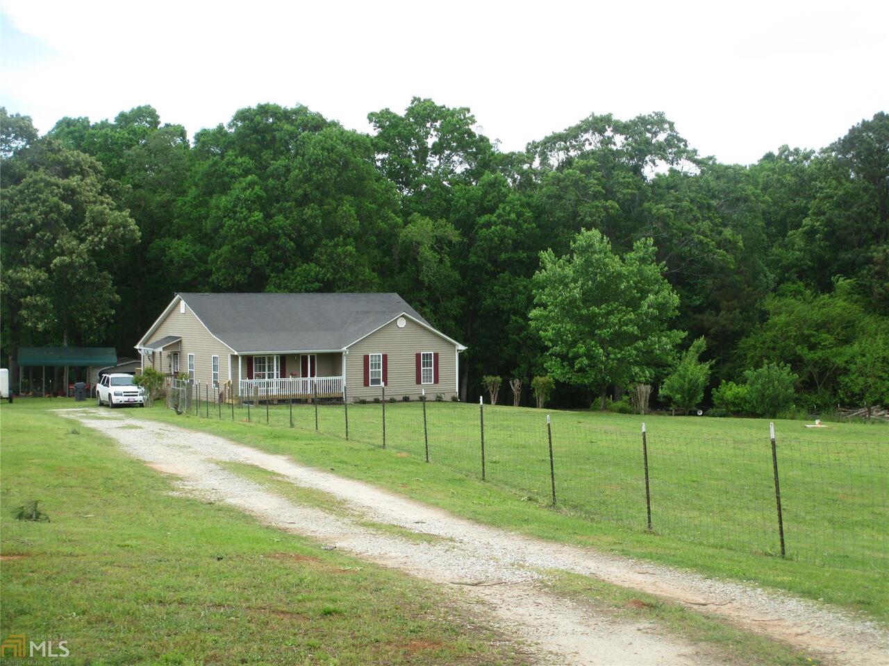 317 Jones Road Milner, GA 30257 - Photo 1 of 1 a view of a house with a backyard