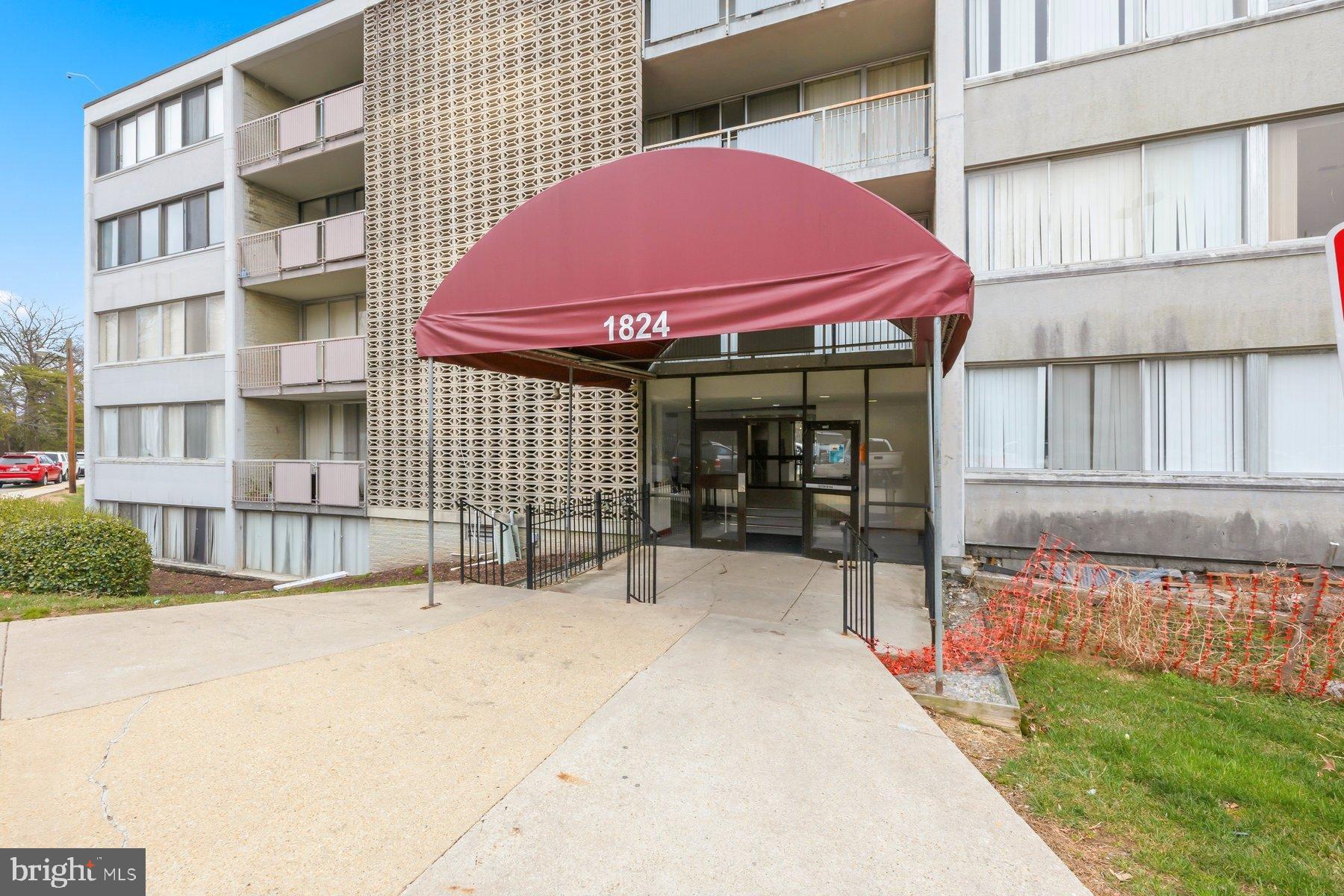 1824 Metzerott Road, Unit 203 Hyattsville, MD 20783 - Photo 1 of 19 a view of a patio with a table and chairs