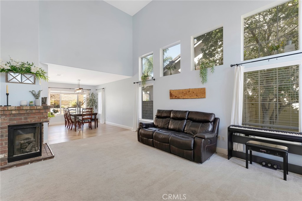 3843 San Gabriel Street Simi Valley, CA 93063 - Photo 14 of 52 a living room with furniture and a fireplace