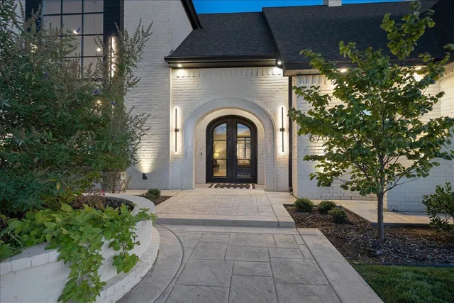 a bathroom with a sink a toilet a shower and a mirror