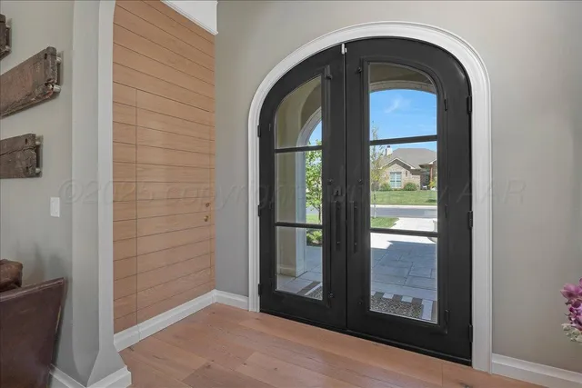 a spacious bedroom with a bed and a window