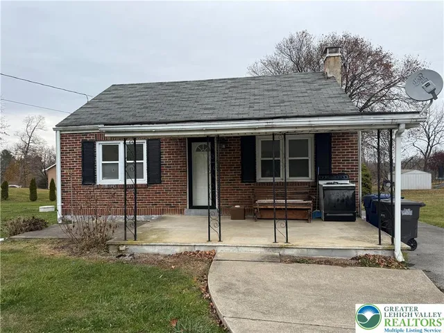 front view of a house with a patio