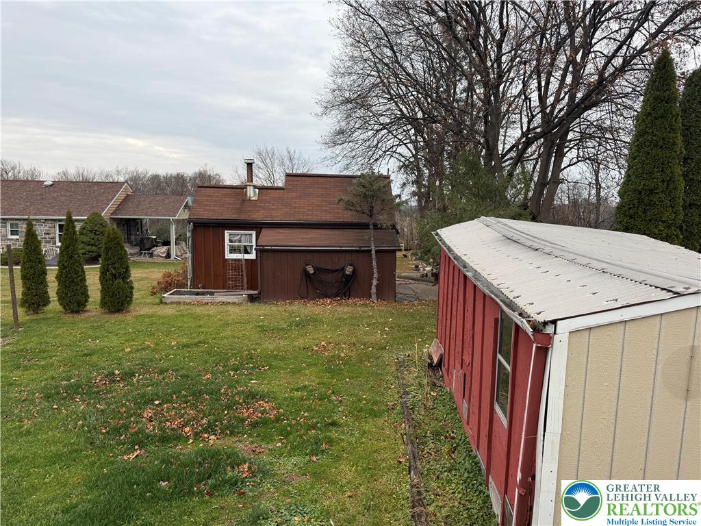 5029 Grammes Road Orefield, PA 18069 - Photo 14 of 14 a view of a house with a backyard and balcony