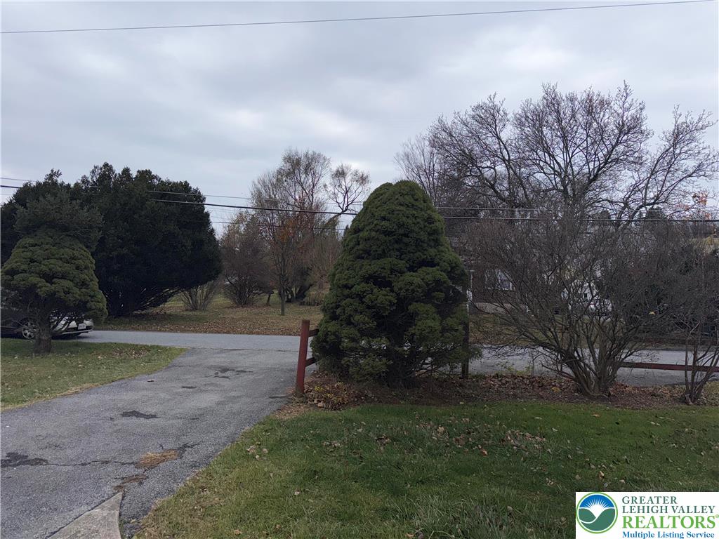 5029 Grammes Road Orefield, PA 18069 - Photo 3 of 14 a big yard with lots of green space and mountain view in back