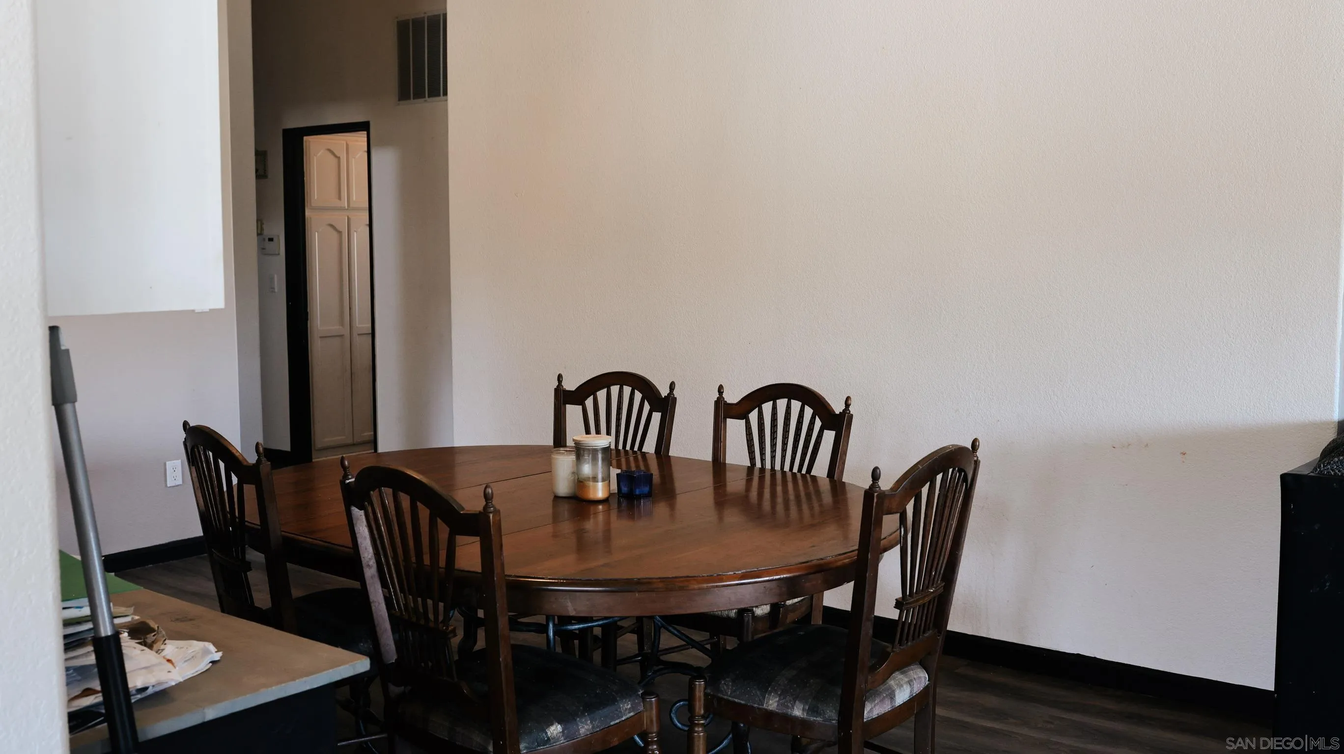 1122 Tierra Del Sol Road Boulevard, CA 91905 - Photo 11 of 26 a view of a dining room with furniture and wooden floor