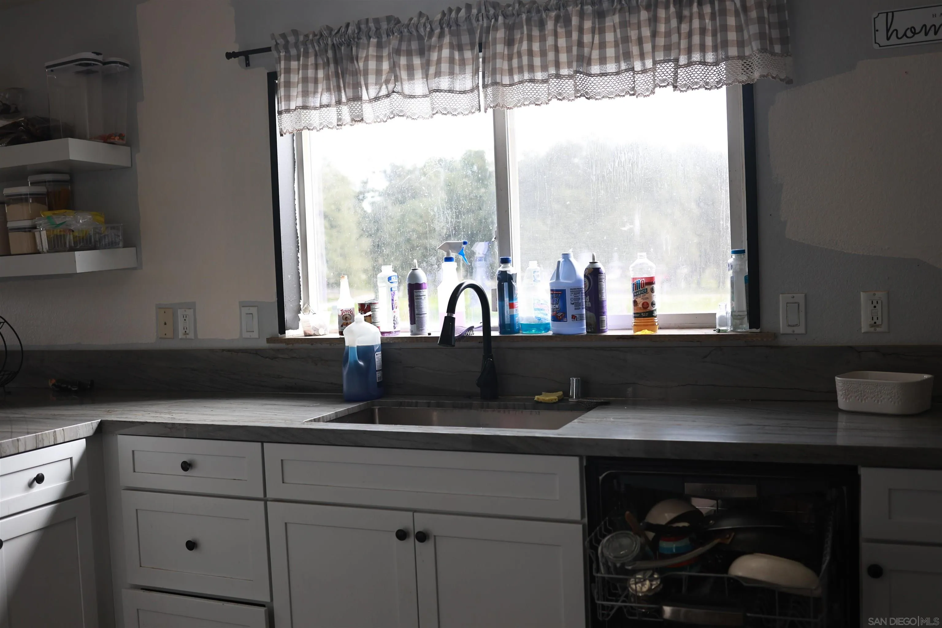 1122 Tierra Del Sol Road Boulevard, CA 91905 - Photo 13 of 26 a kitchen with a sink and large window