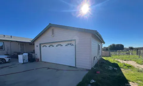 a view of a back yard of the house