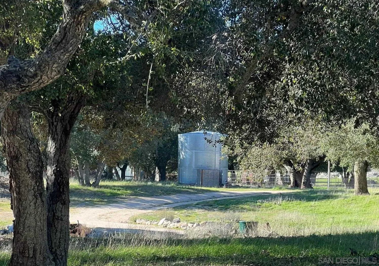 1122 Tierra Del Sol Road Boulevard, CA 91905 - Photo 20 of 26 a view of a house with swimming pool and a yard