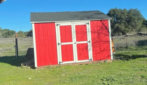 a view of pool with red yard