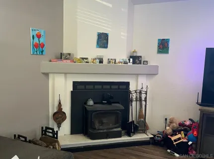 a hallway with a fireplace and a couch