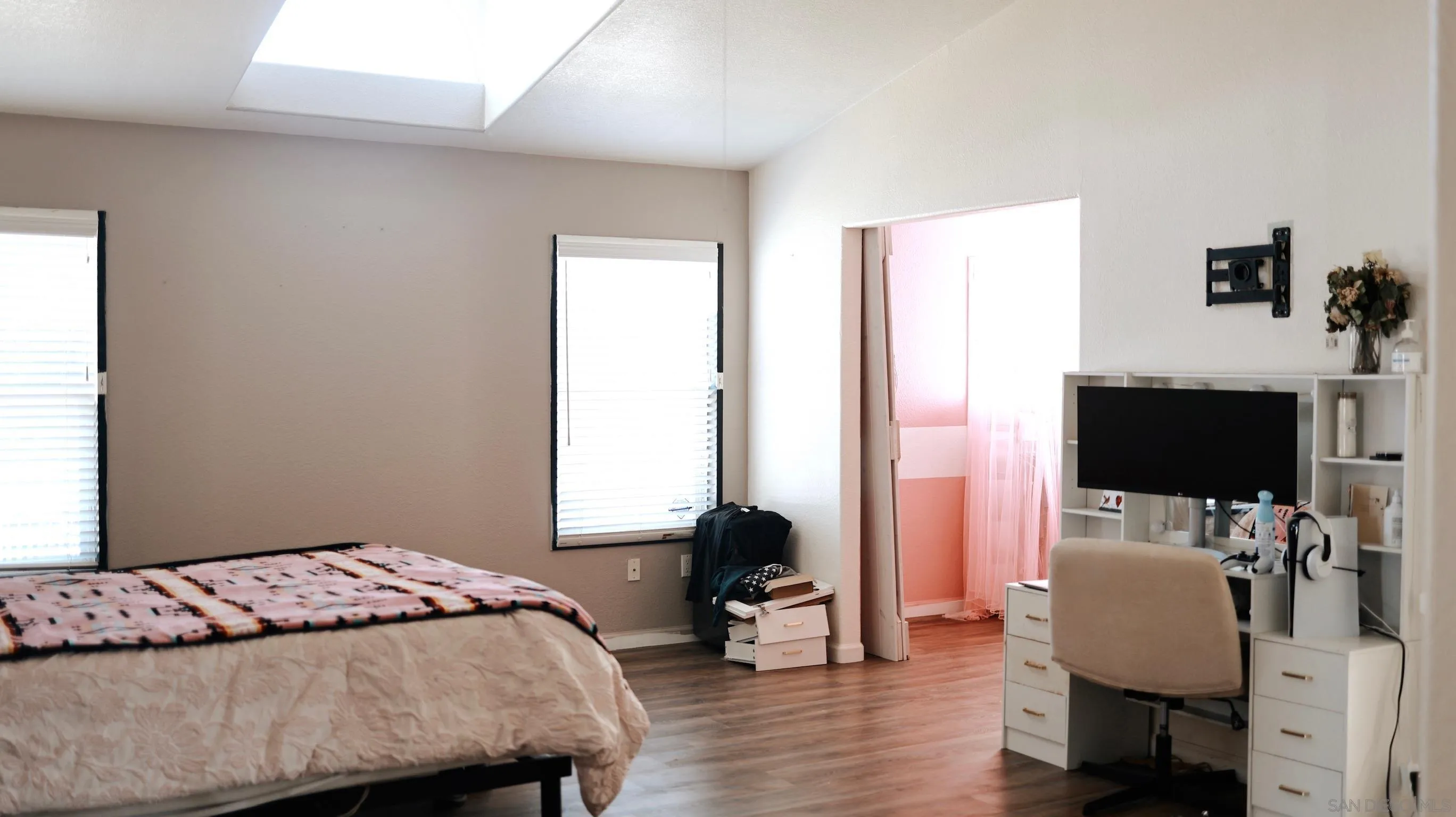 1122 Tierra Del Sol Road Boulevard, CA 91905 - Photo 8 of 26 a bedroom with a bed and a flat screen tv