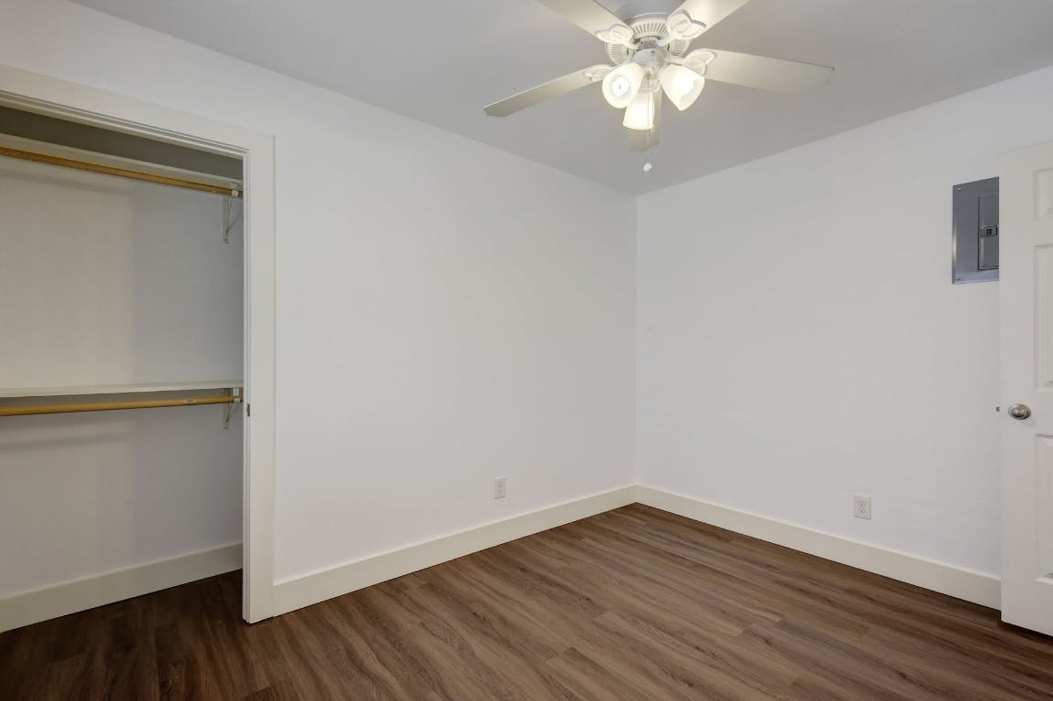 1311 East 52nd Street, Unit 3 Austin, TX 78723 - Photo 13 of 20 a view of an empty room with wooden floor and a window