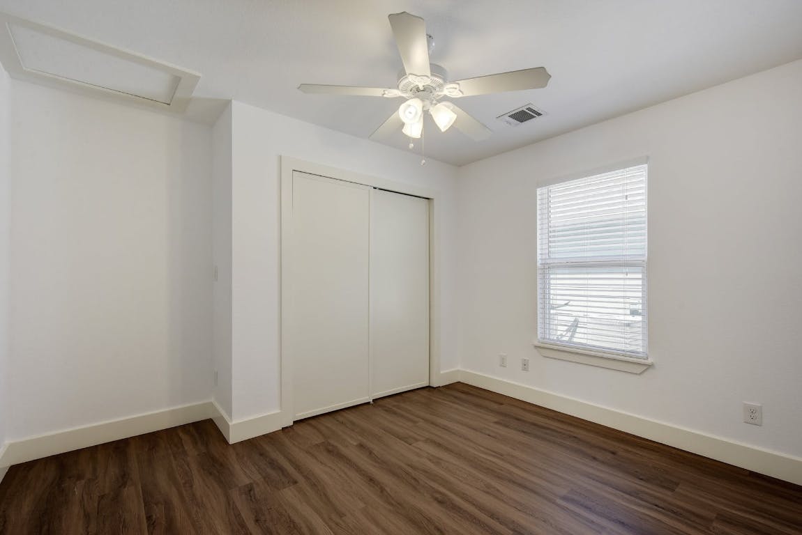 1311 East 52nd Street, Unit 3 Austin, TX 78723 - Photo 14 of 20 an empty room with wooden floor and windows