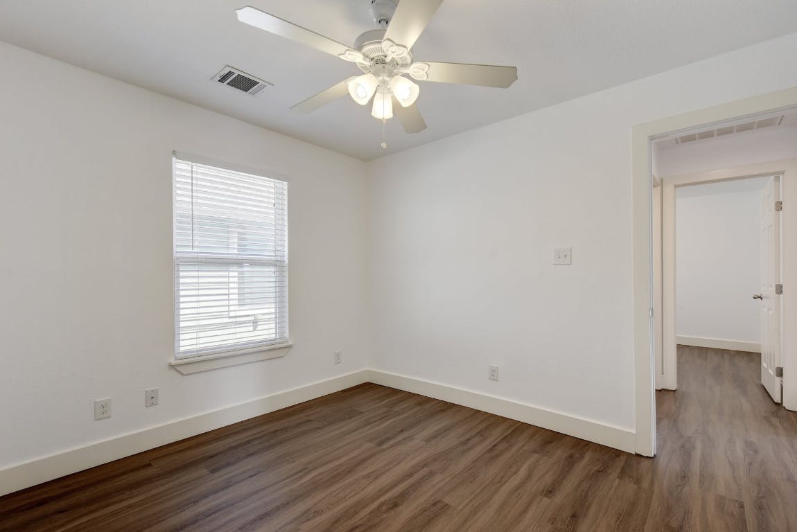 1311 East 52nd Street, Unit 3 Austin, TX 78723 - Photo 15 of 20 an empty room with wooden floor and windows