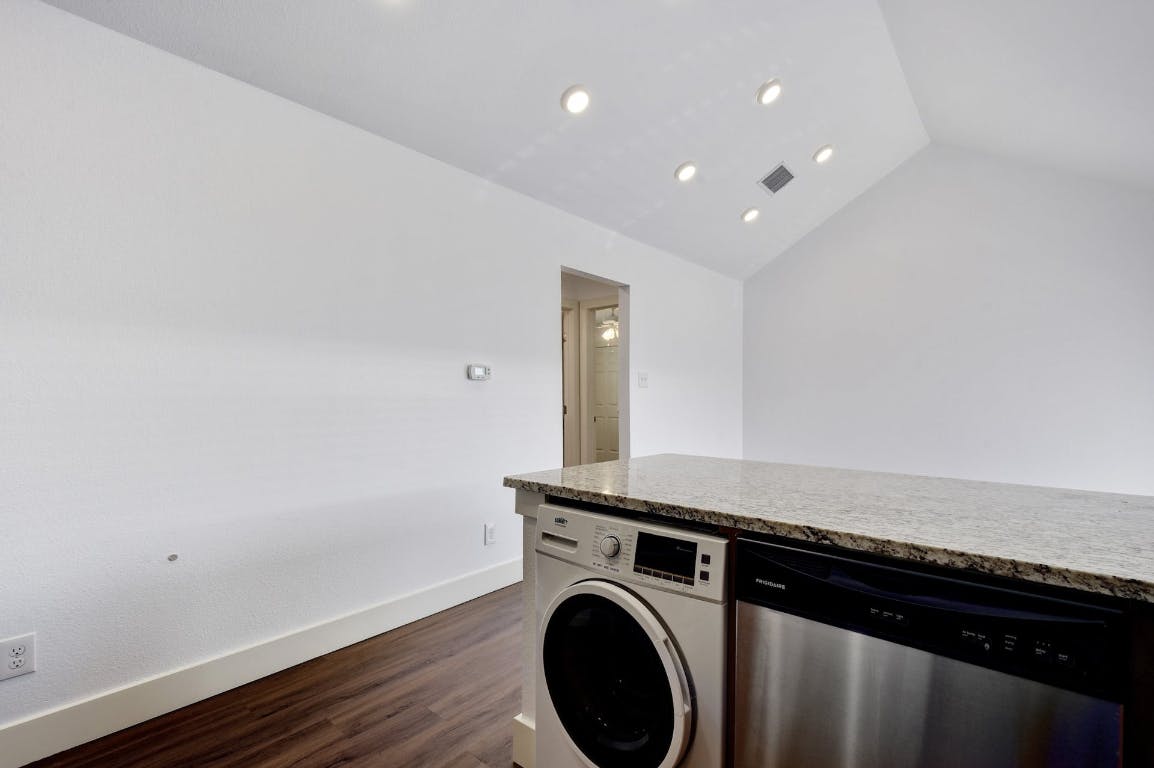 1311 East 52nd Street, Unit 3 Austin, TX 78723 - Photo 9 of 20 a view of a storage & utility room with wooden floor
