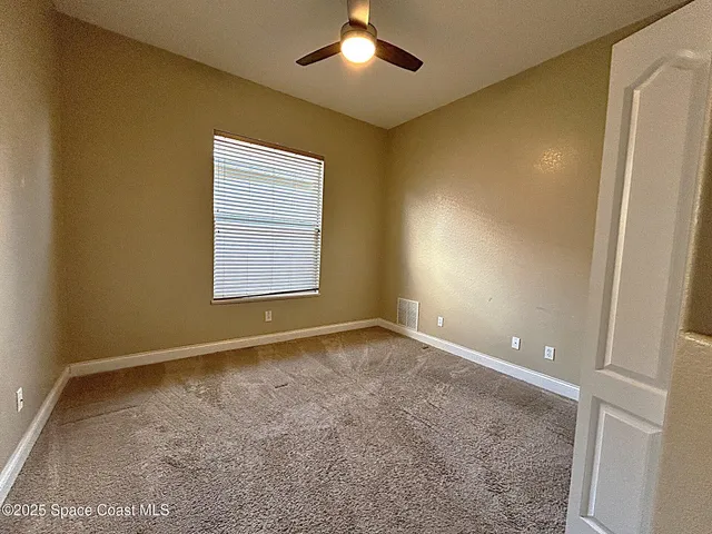 an empty room with a empty space and a window