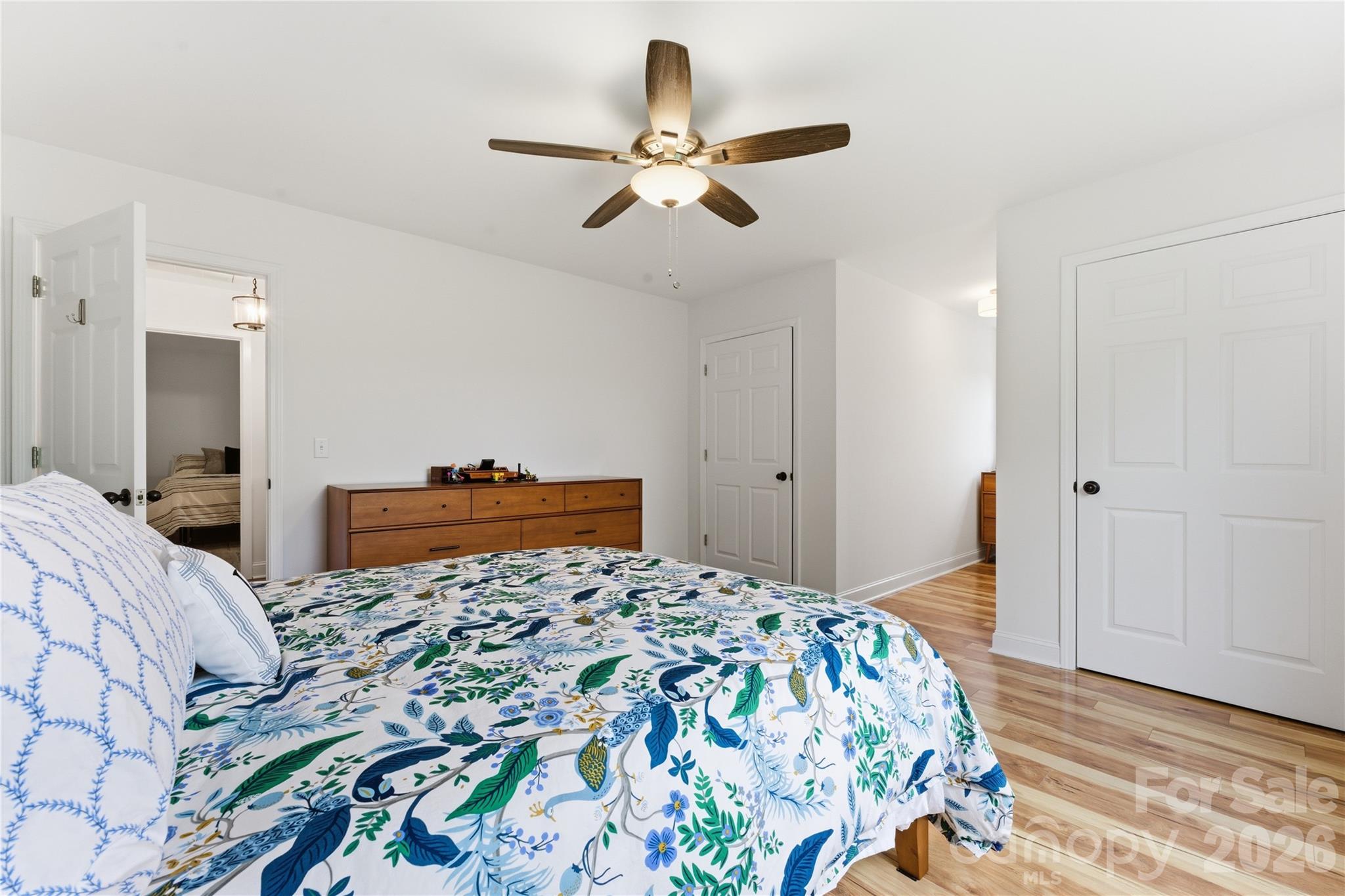 15 Raccoon Point Canton, NC 28716 - Photo 29 of 48 a bedroom with a large bed and a chandelier