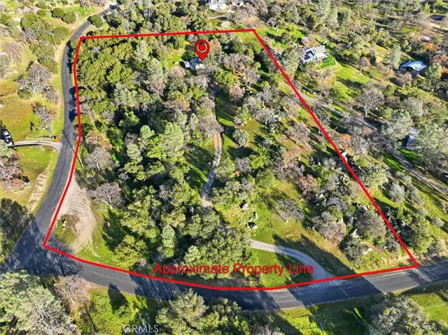 a view of a room with wooden floor and bathroom