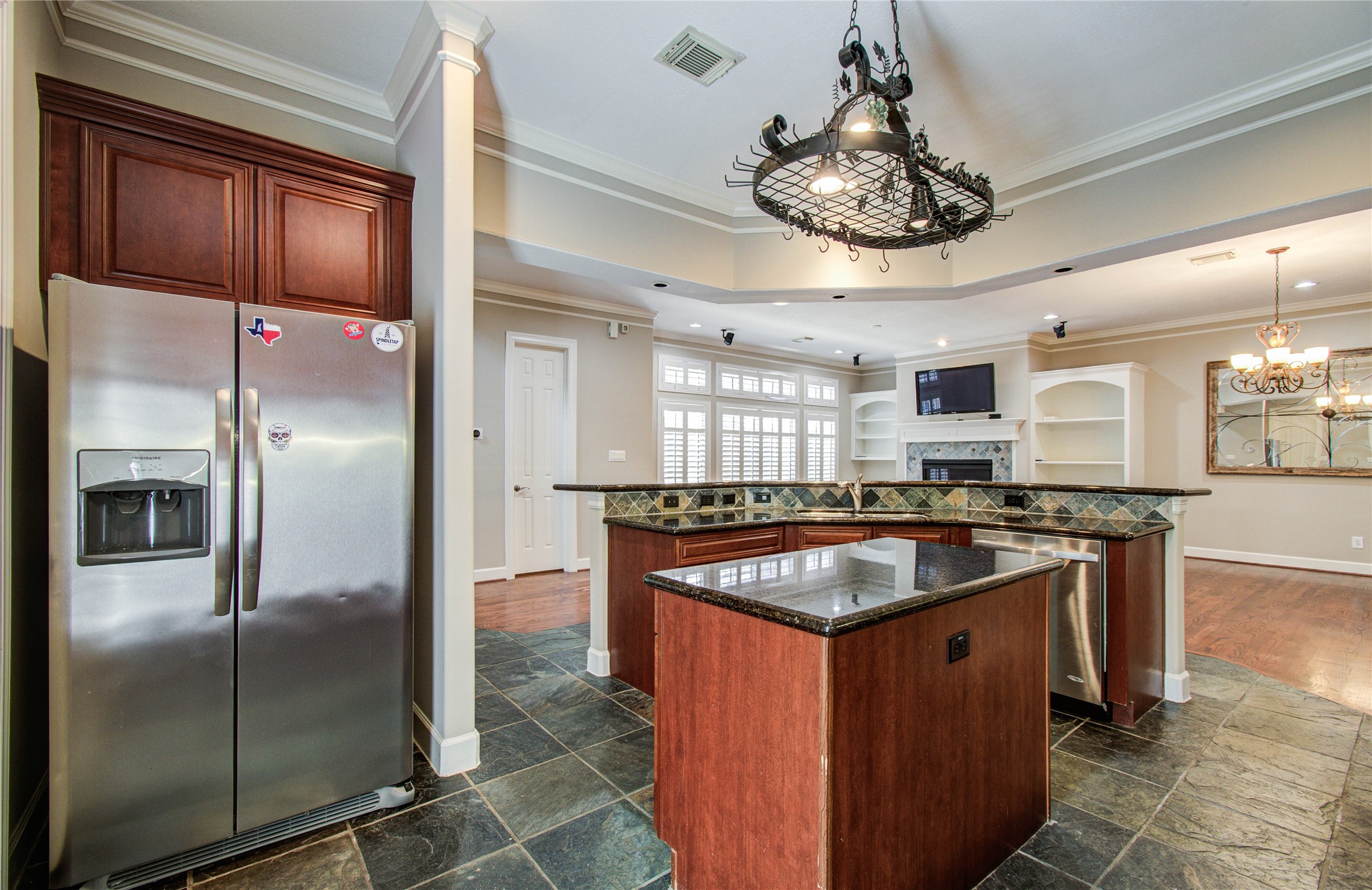 4613 Floyd Street Houston, TX 77007 - Photo 12 of 37 a kitchen with stainless steel appliances granite countertop a sink and a refrigerator