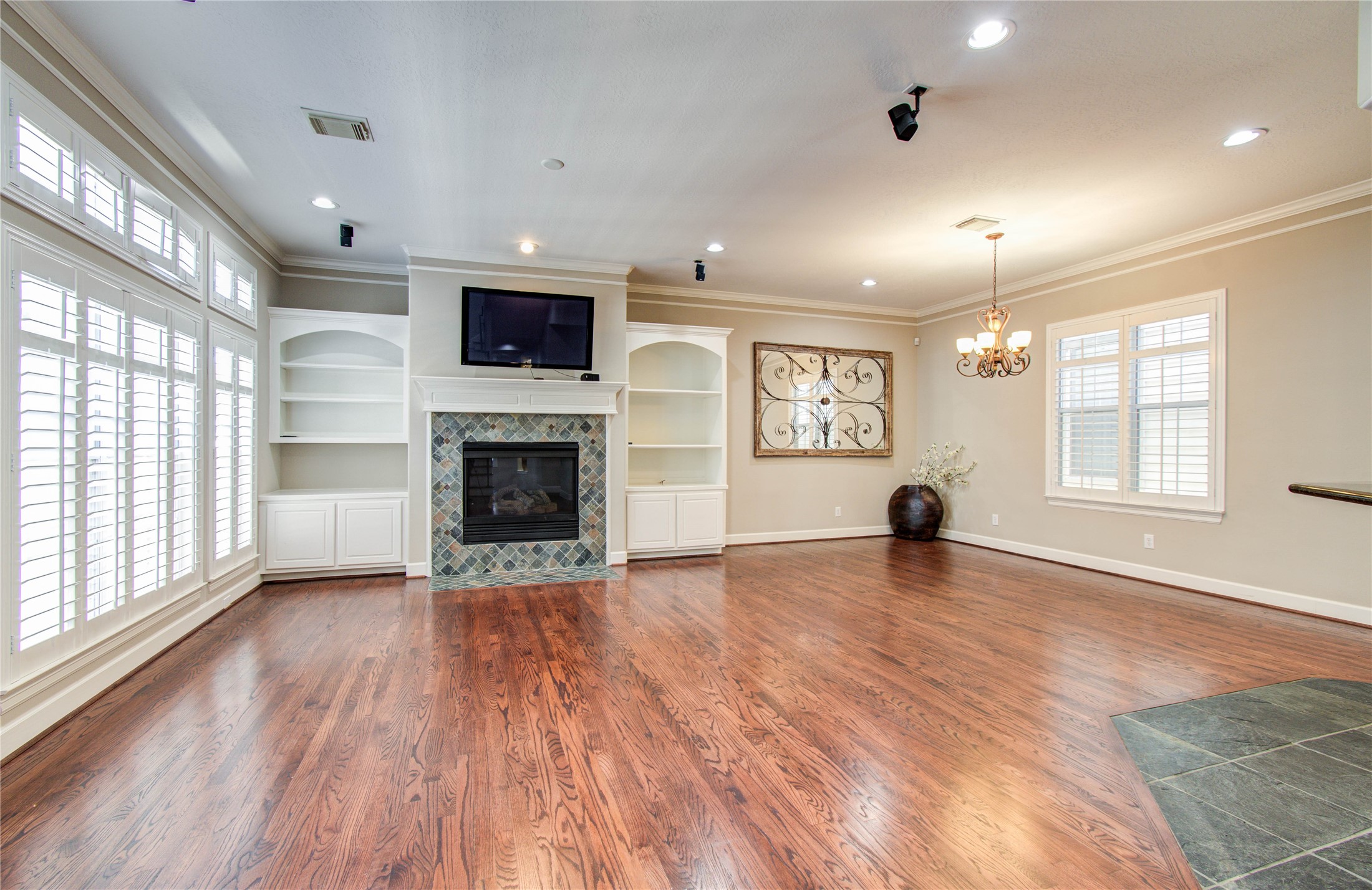 4613 Floyd Street Houston, TX 77007 - Photo 14 of 37 an empty room with wooden floor and fireplace