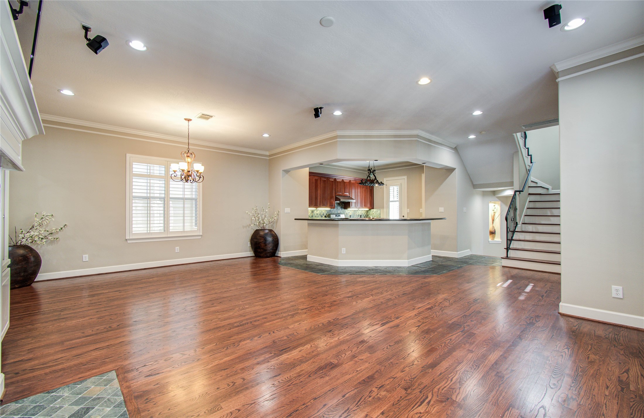 4613 Floyd Street Houston, TX 77007 - Photo 15 of 37 an empty room with wooden floor and windows
