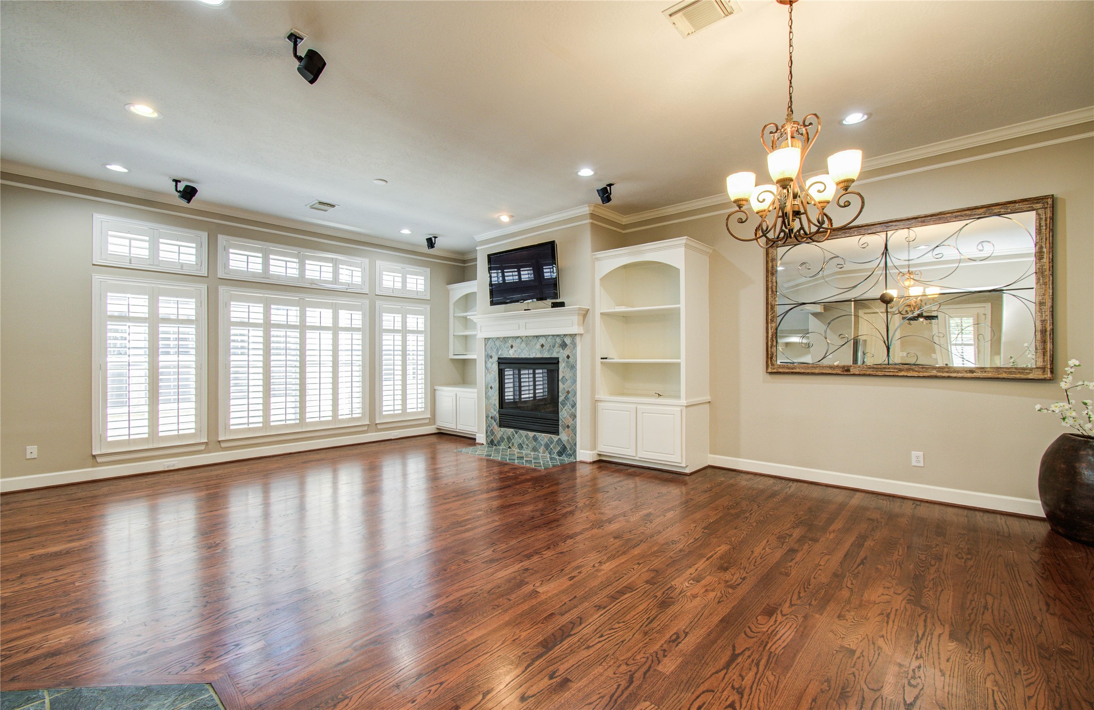 4613 Floyd Street Houston, TX 77007 - Photo 17 of 37 a view of an empty room with wooden floor and a window