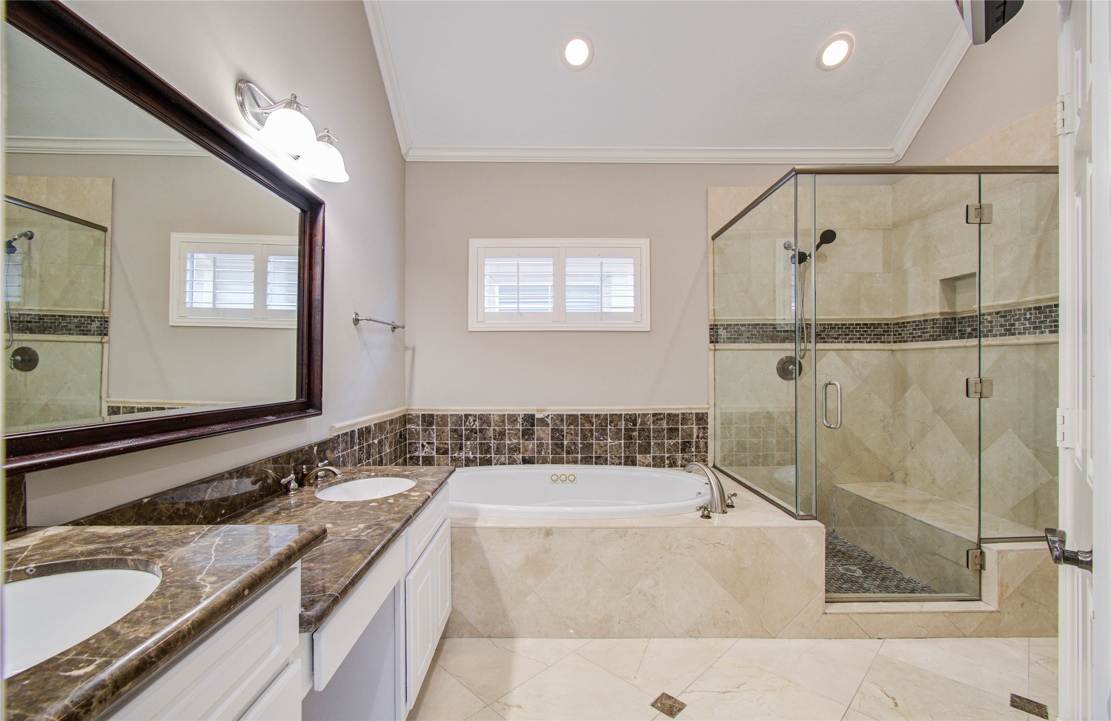 4613 Floyd Street Houston, TX 77007 - Photo 26 of 37 a bathroom with a granite countertop tub sink and mirror