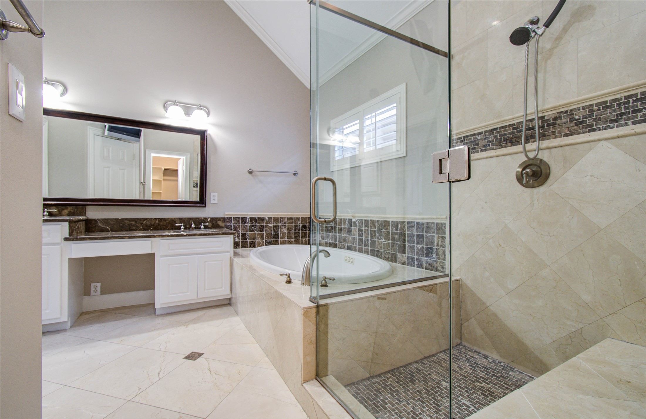 4613 Floyd Street Houston, TX 77007 - Photo 28 of 37 a bathroom with a sink a granite counter and shower
