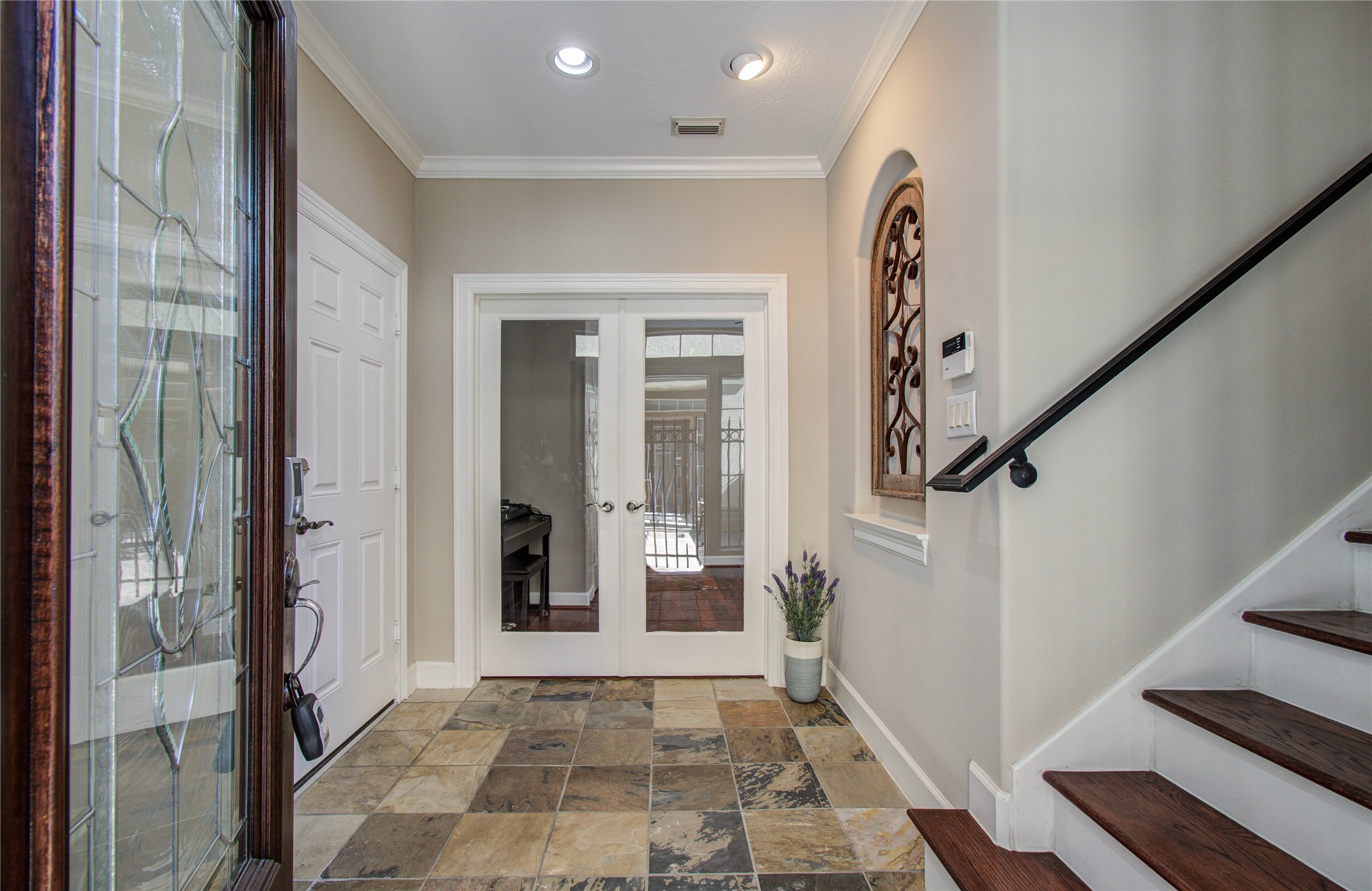 4613 Floyd Street Houston, TX 77007 - Photo 4 of 37 a view of an entryway with wooden floor and a livingroom