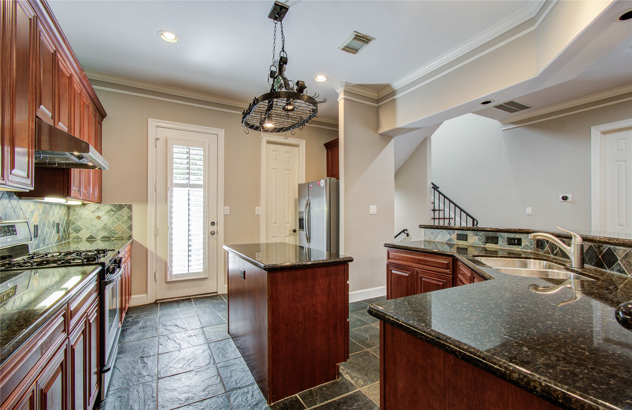 4613 Floyd Street Houston, TX 77007 - Photo 9 of 37 a kitchen with a stove a sink and a refrigerator