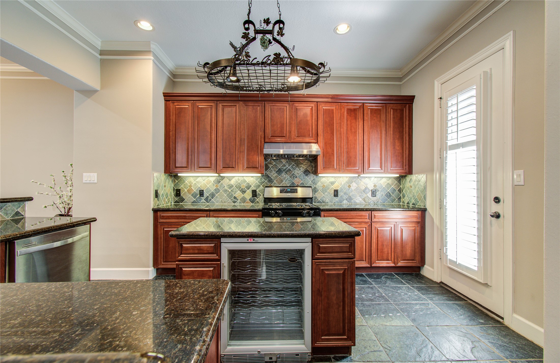 4613 Floyd Street Houston, TX 77007 - Photo 10 of 37 a kitchen with stainless steel appliances granite countertop a stove and a cabinets