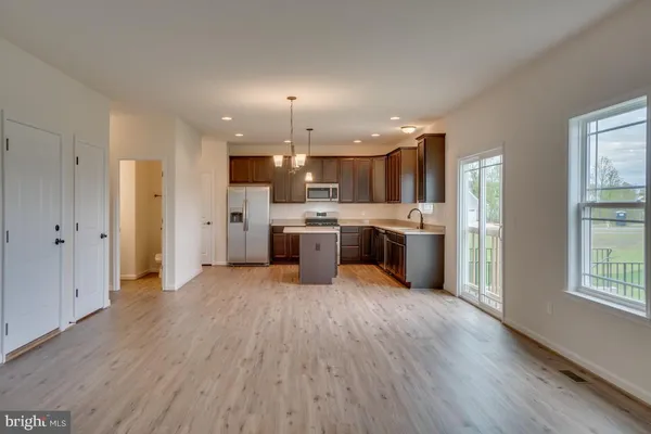 a view of kitchen with wooden floor