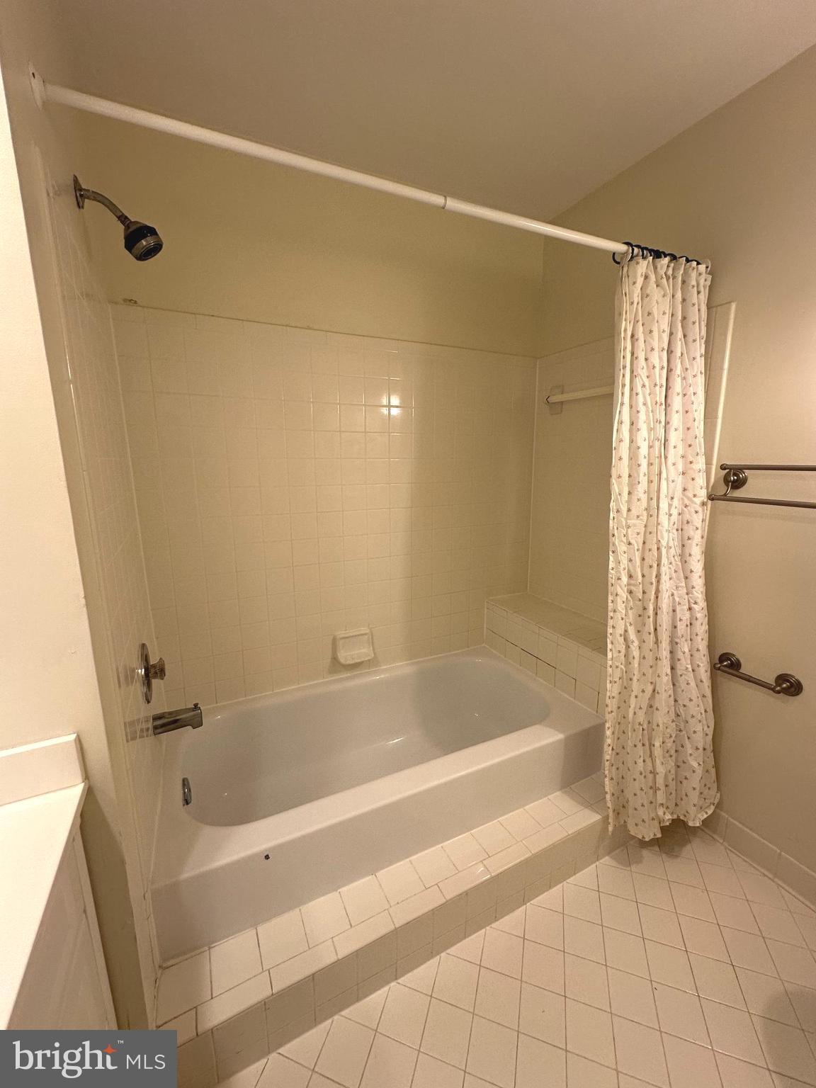 7808 Spinnaker Road, Unit 12 Laurel, MD 20707 - Photo 12 of 23 a bathroom with a bathtub and a shower