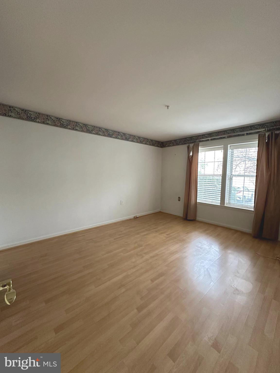 7808 Spinnaker Road, Unit 12 Laurel, MD 20707 - Photo 18 of 23 a view of an empty room with a window