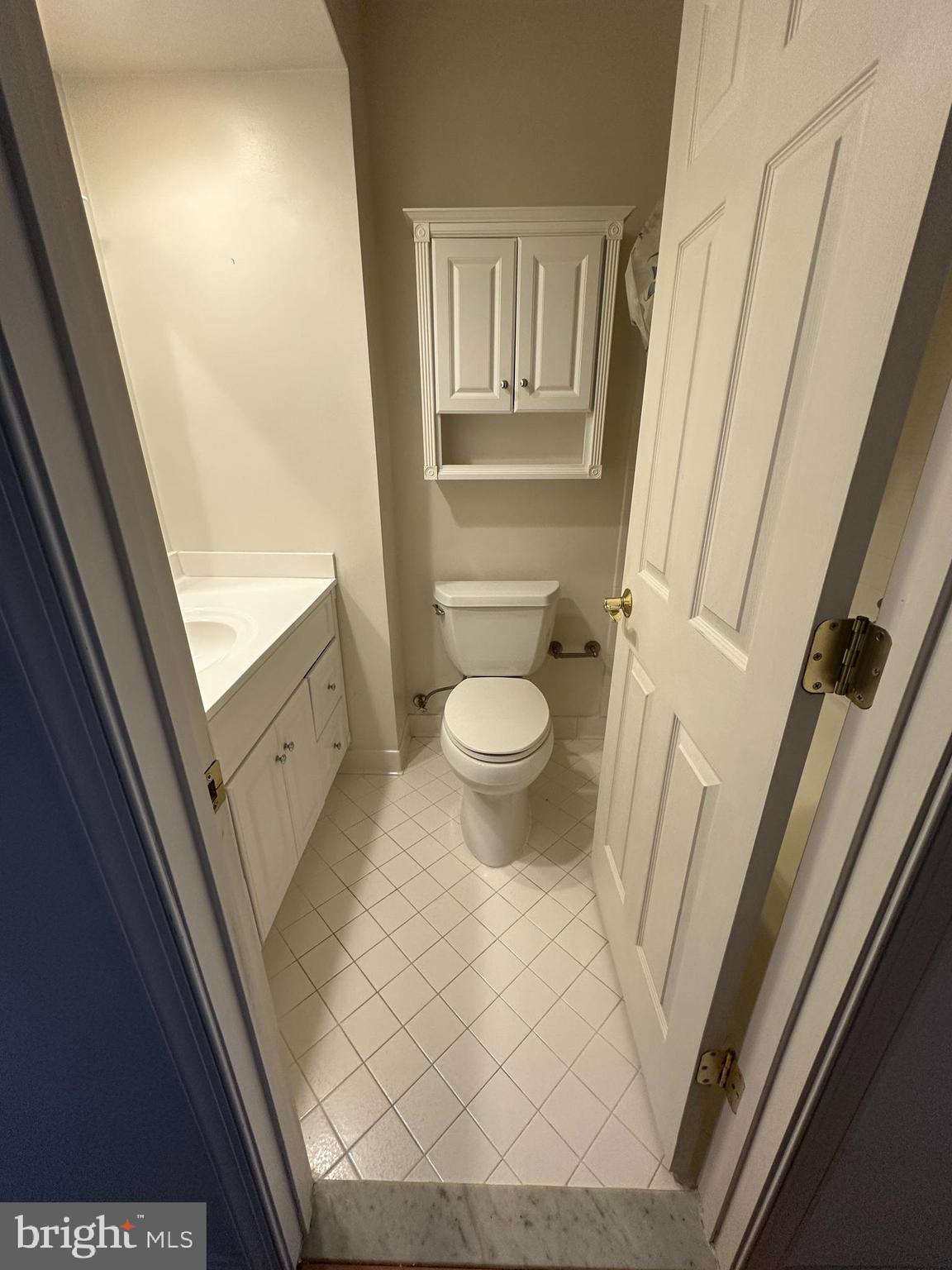 7808 Spinnaker Road, Unit 12 Laurel, MD 20707 - Photo 22 of 23 a bathroom with a sink and a toilet
