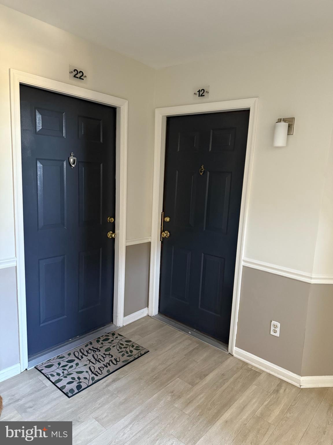 7808 Spinnaker Road, Unit 12 Laurel, MD 20707 - Photo 4 of 23 a view of a hallway with wooden floor and cabinet
