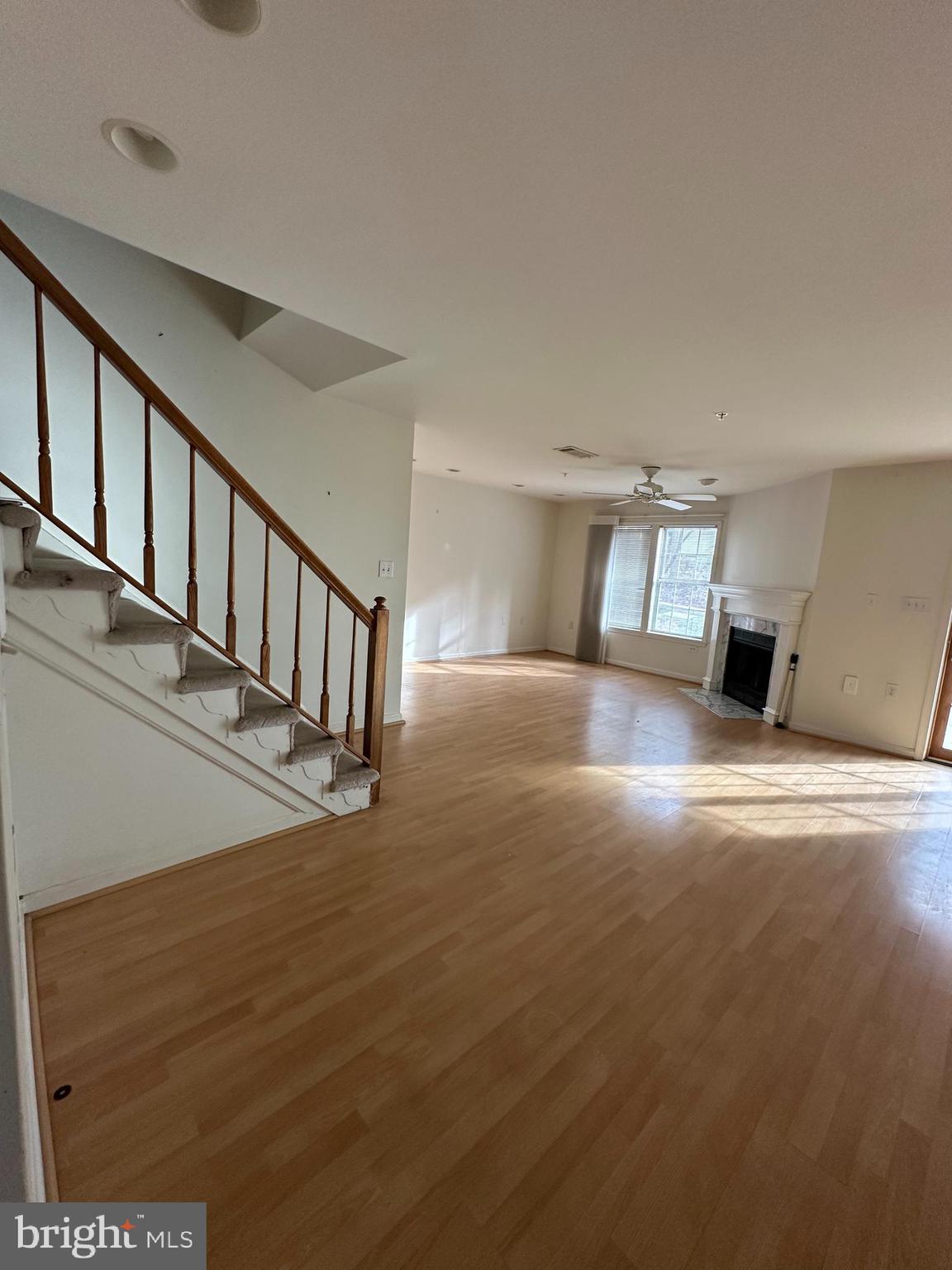 7808 Spinnaker Road, Unit 12 Laurel, MD 20707 - Photo 10 of 23 a view of staircase and living room with wooden floor