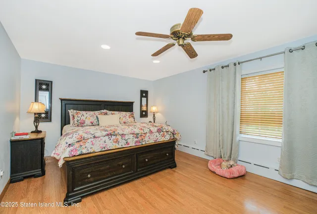 a bedroom with a bed and window