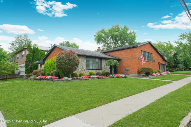 front view of a house with a garden