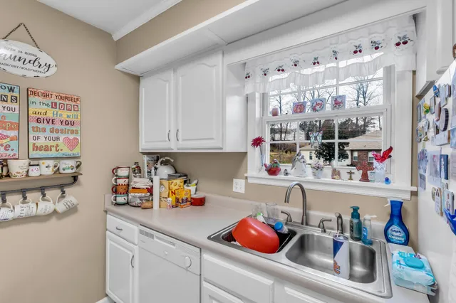 a kitchen with stainless steel appliances a sink stove and refrigerator